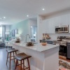 kitchen with an island and bar stools