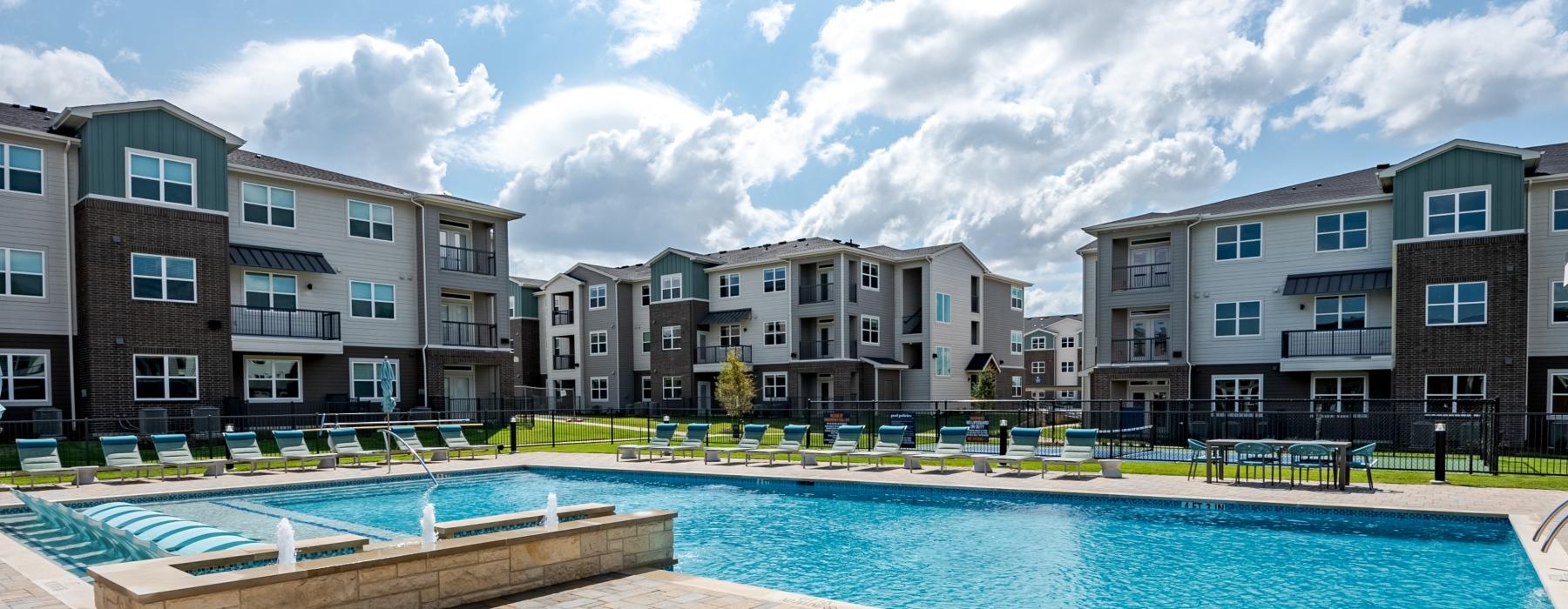 a swimming pool surrounded by buildings